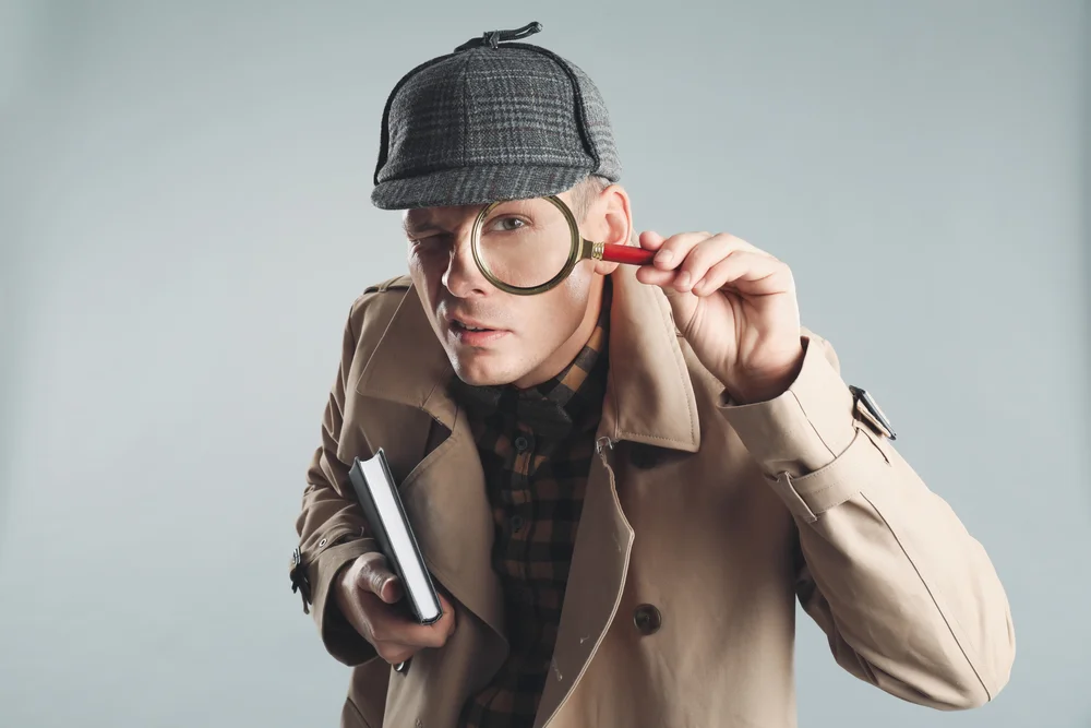 man in a detective costume