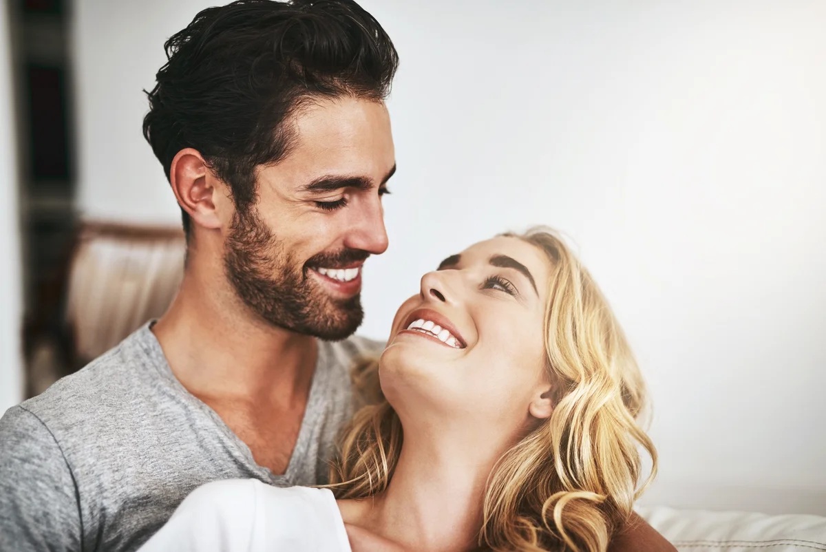 Close-up portrait of gorgeous couple looking at each other with love