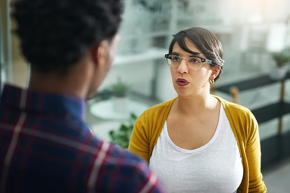 A person speaking to another expressing a point of view