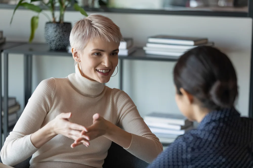 Confident, intelligent short-haired woman having a conversation