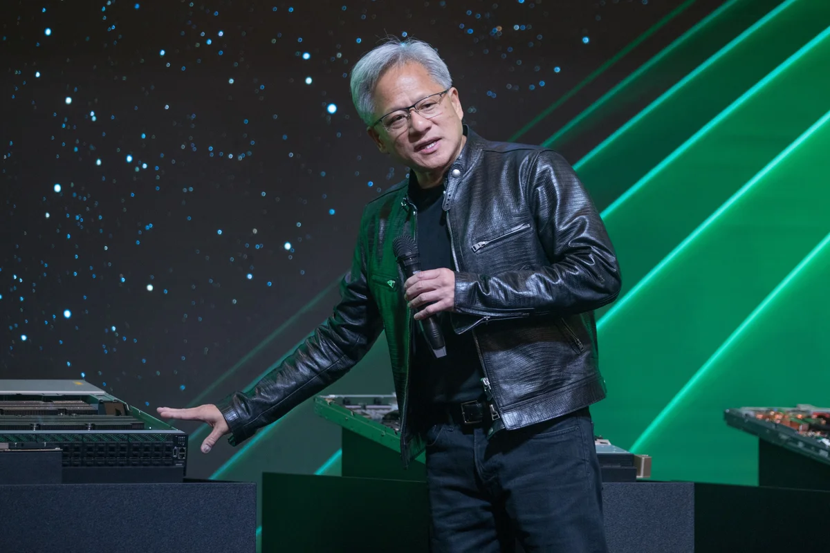 Jensen Huang gestures and talks during a News event in Taipei.