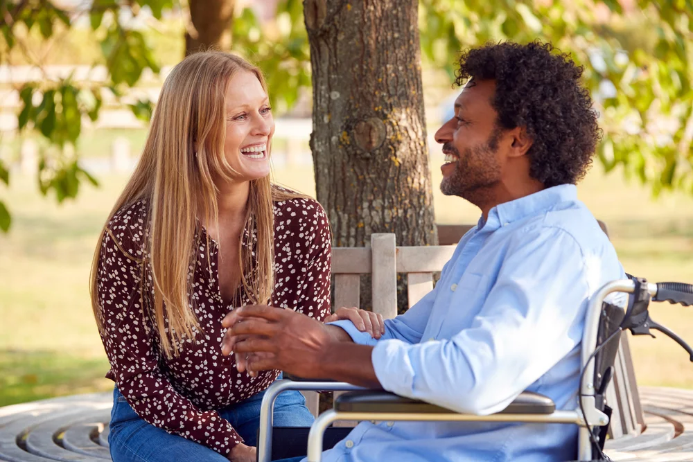 two people talking outdoors