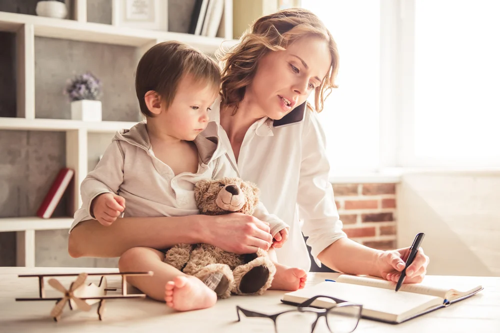 mom and baby writing a note