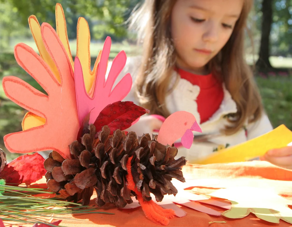 girl doing a Thanksgiving art project