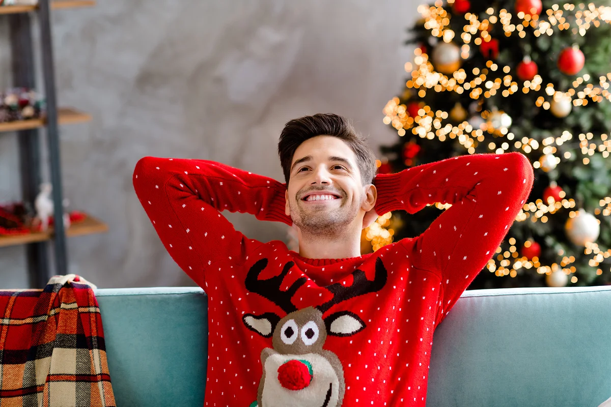 young male wear red christmas sweater