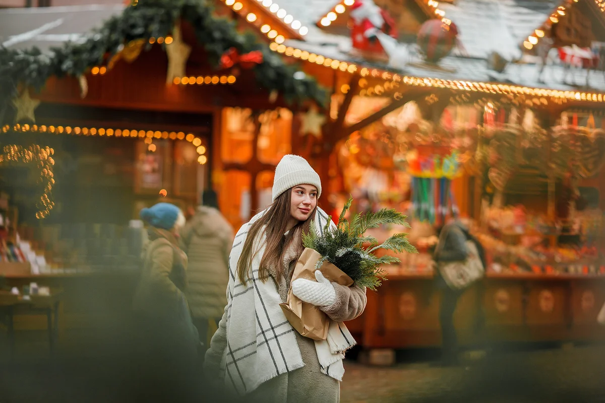 Happy young woman at Christmas market