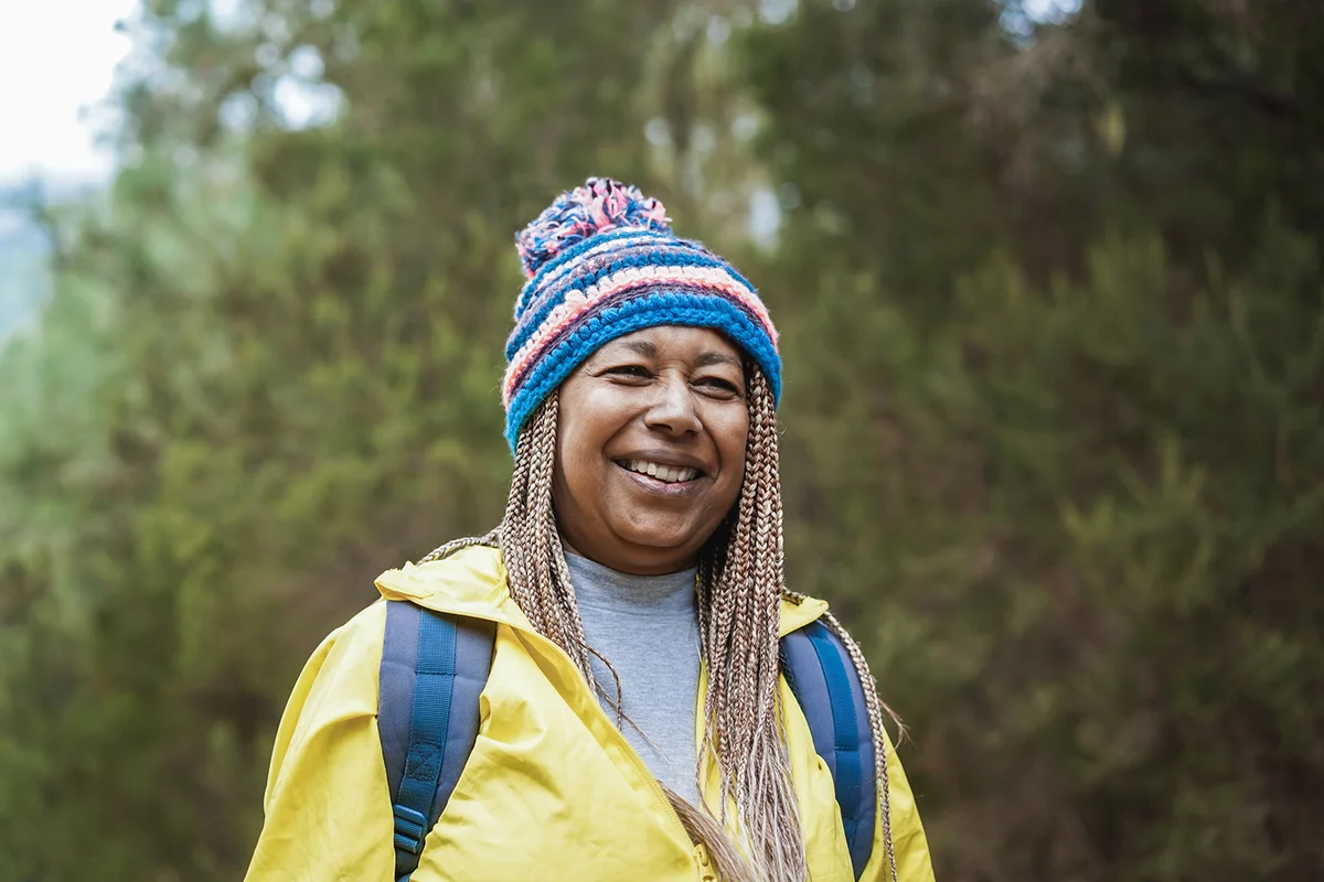woman having fun during trekking day in to the wood
