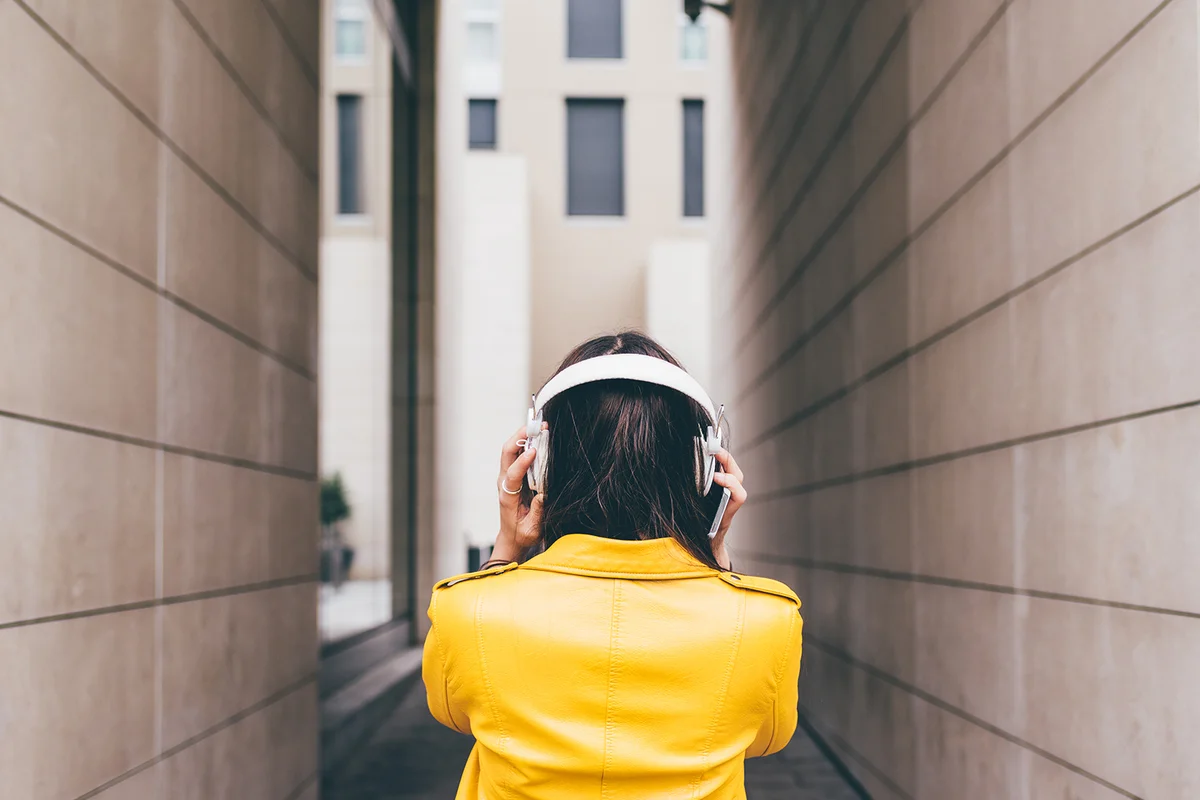 woman listening music with headphones