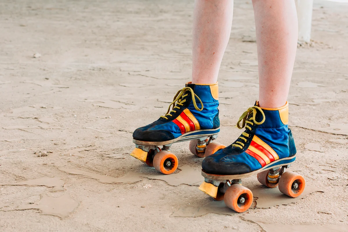 Close-up photo of retro colorful roller skates. 80s fashion