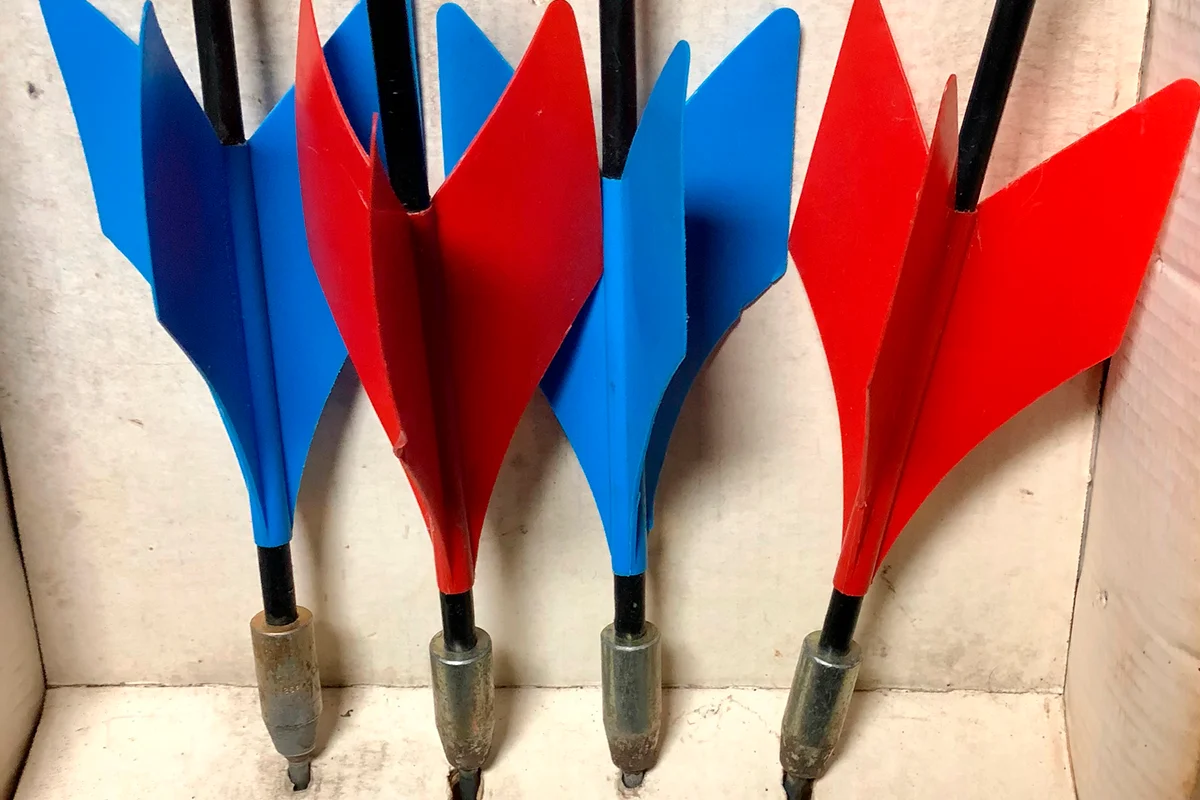 Close-up of old vintage set of red and blue lawn darts