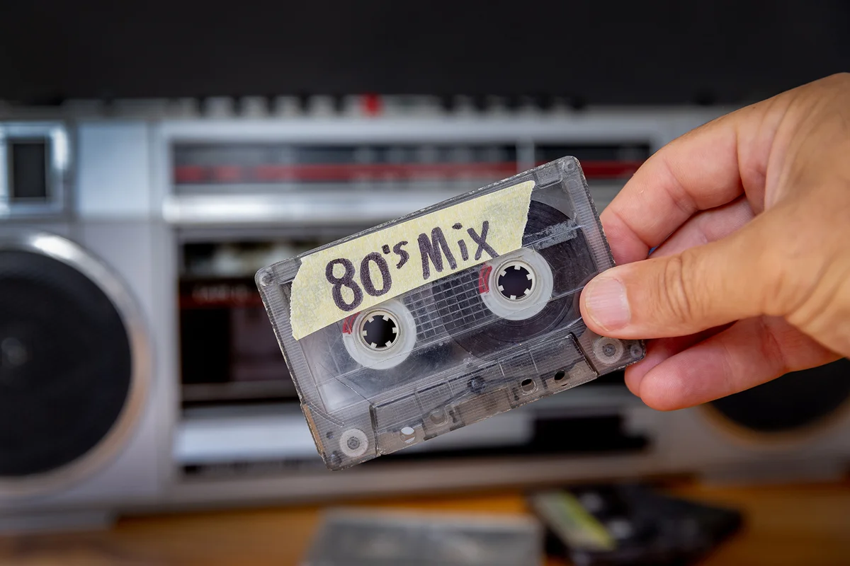 Cassette tape with stereo in the background