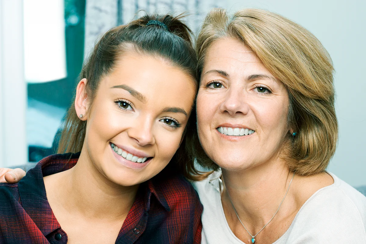Portrait Of Mature Mother With Teenage Daughter