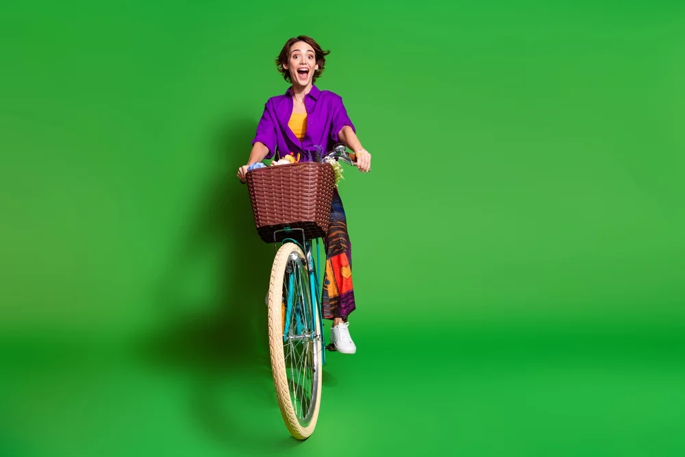 woman on bike in baggy pants