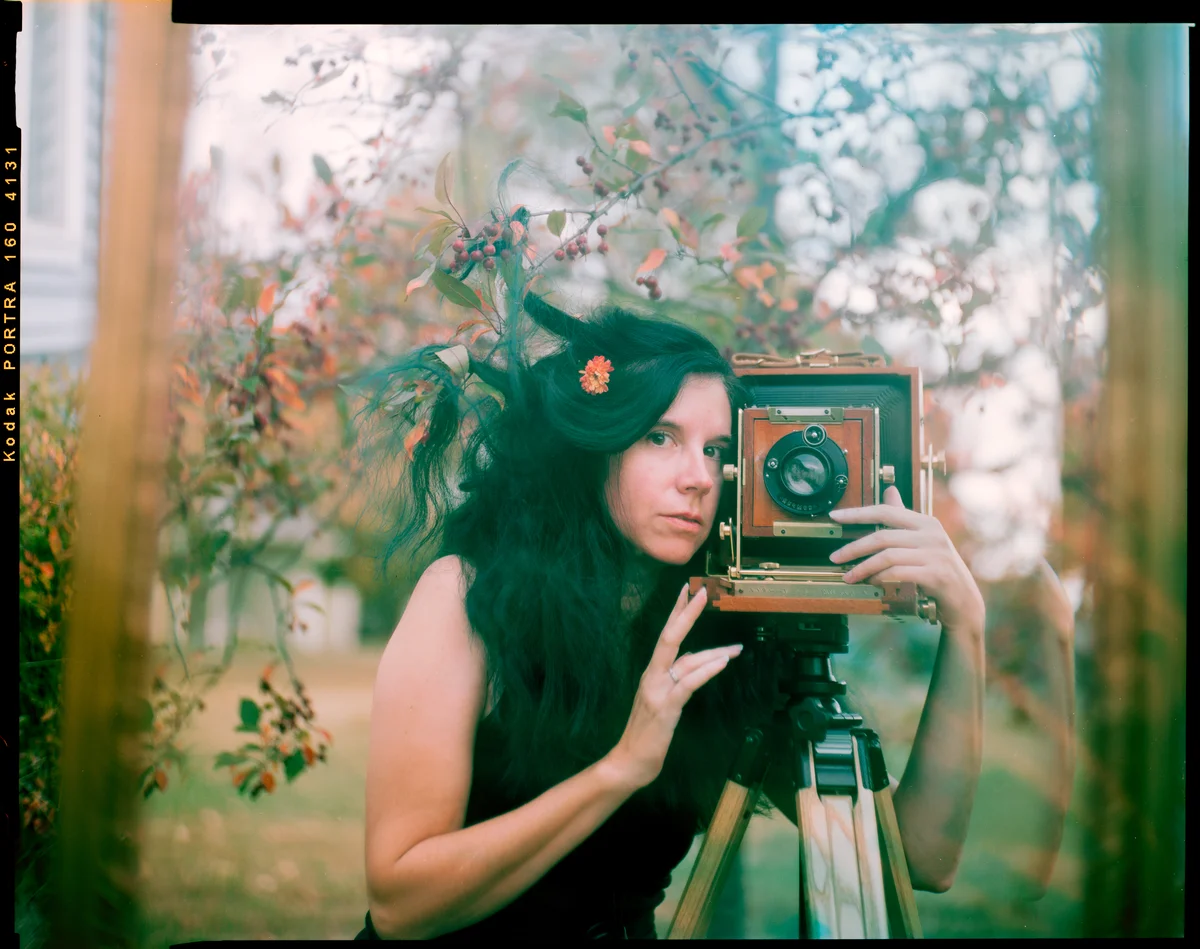 self portrait with camera by Kate Miller-Wilson