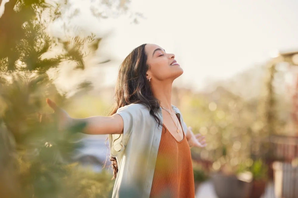 Woman with her arms outstretched