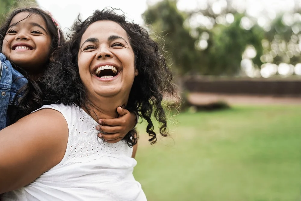 mother and daughter laughing