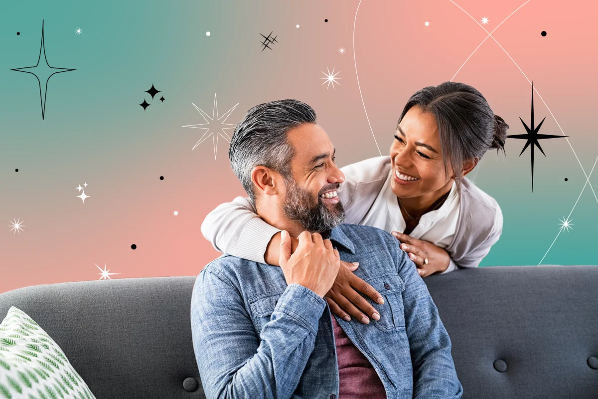 Couple laughing and embracing at home