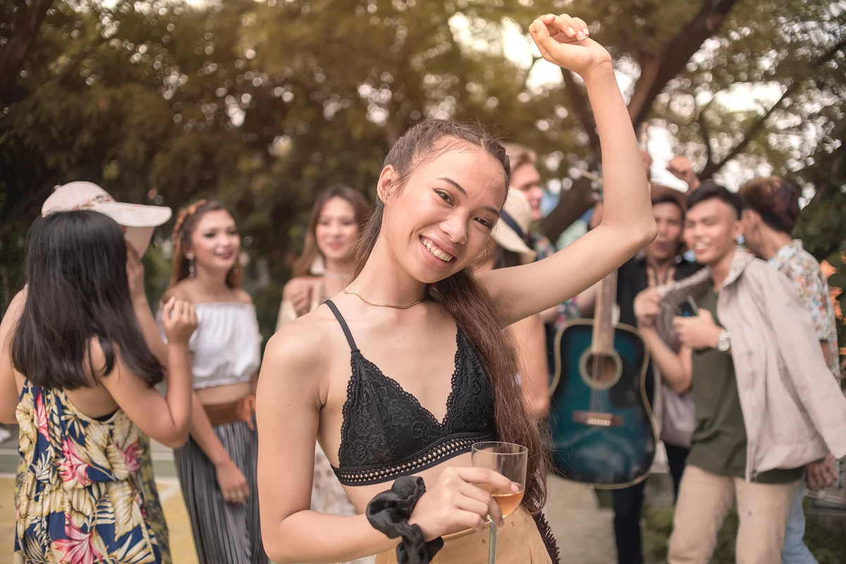 people in bohemian outfits party away at a music festival or other hippie celebration