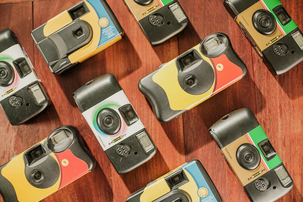 Top down shot background of disposable single use film camera on floor