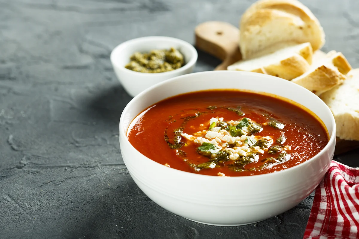 Tomato soup with cheese and pesto sauce