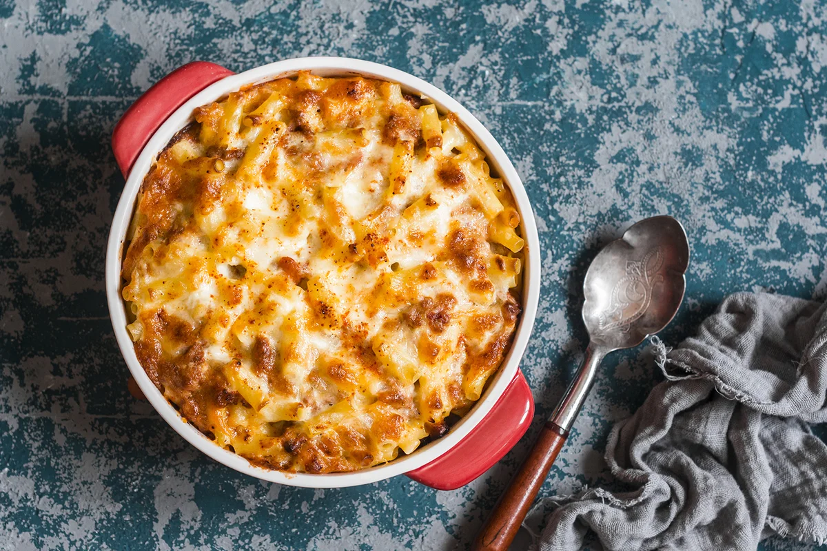Mac and cheese. Macaroni and cheese with meat tomato sauce