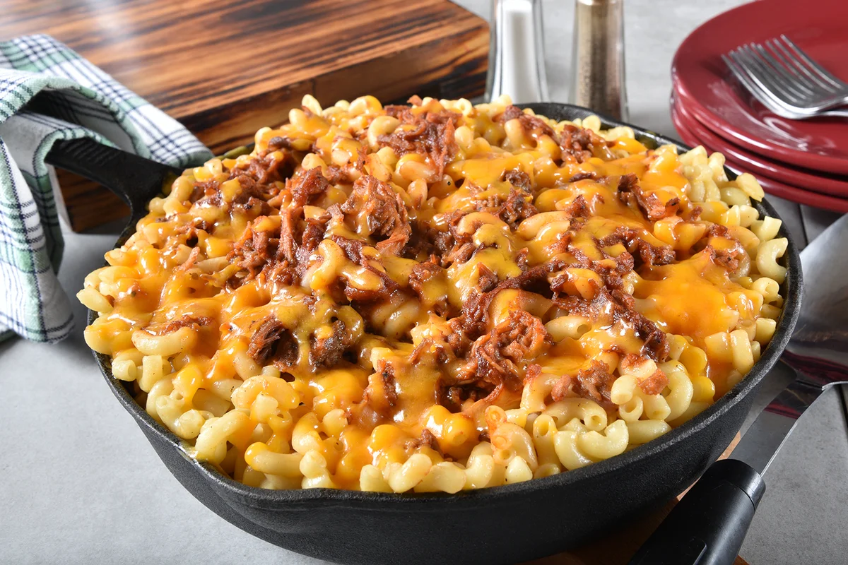 BBQ Beef macaroni and cheese served in a cast iron skillet