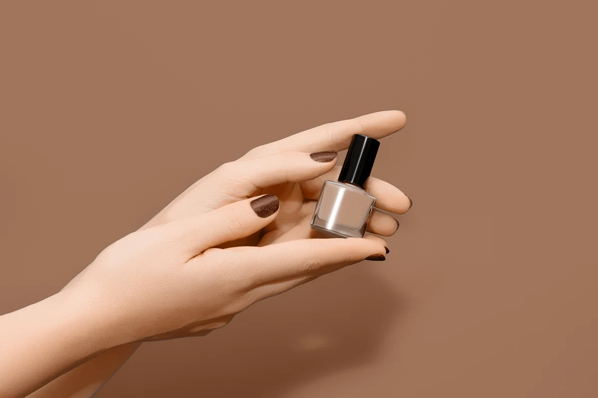 Female hands with brown nail design