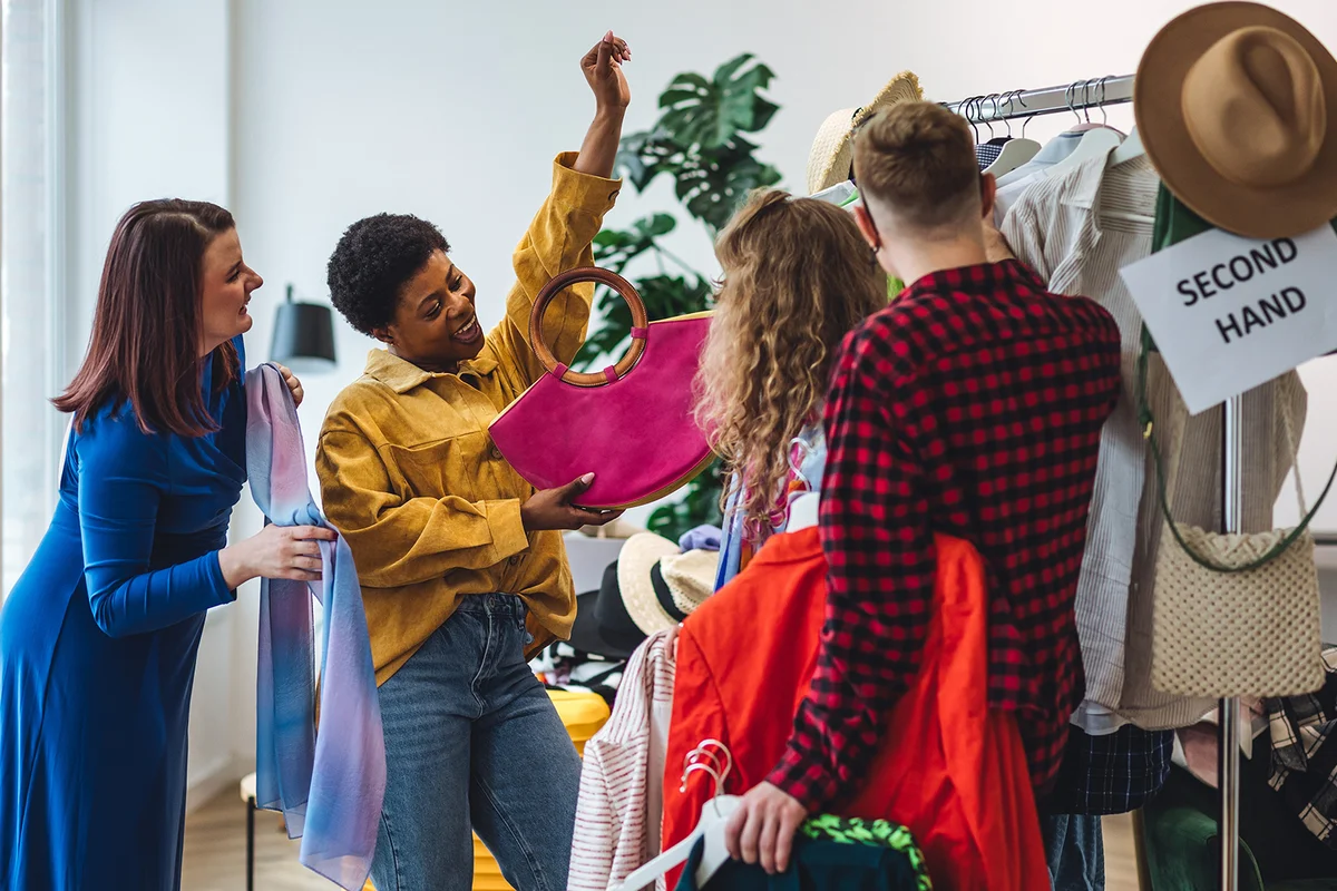 young attractive people shopping in secondhand store