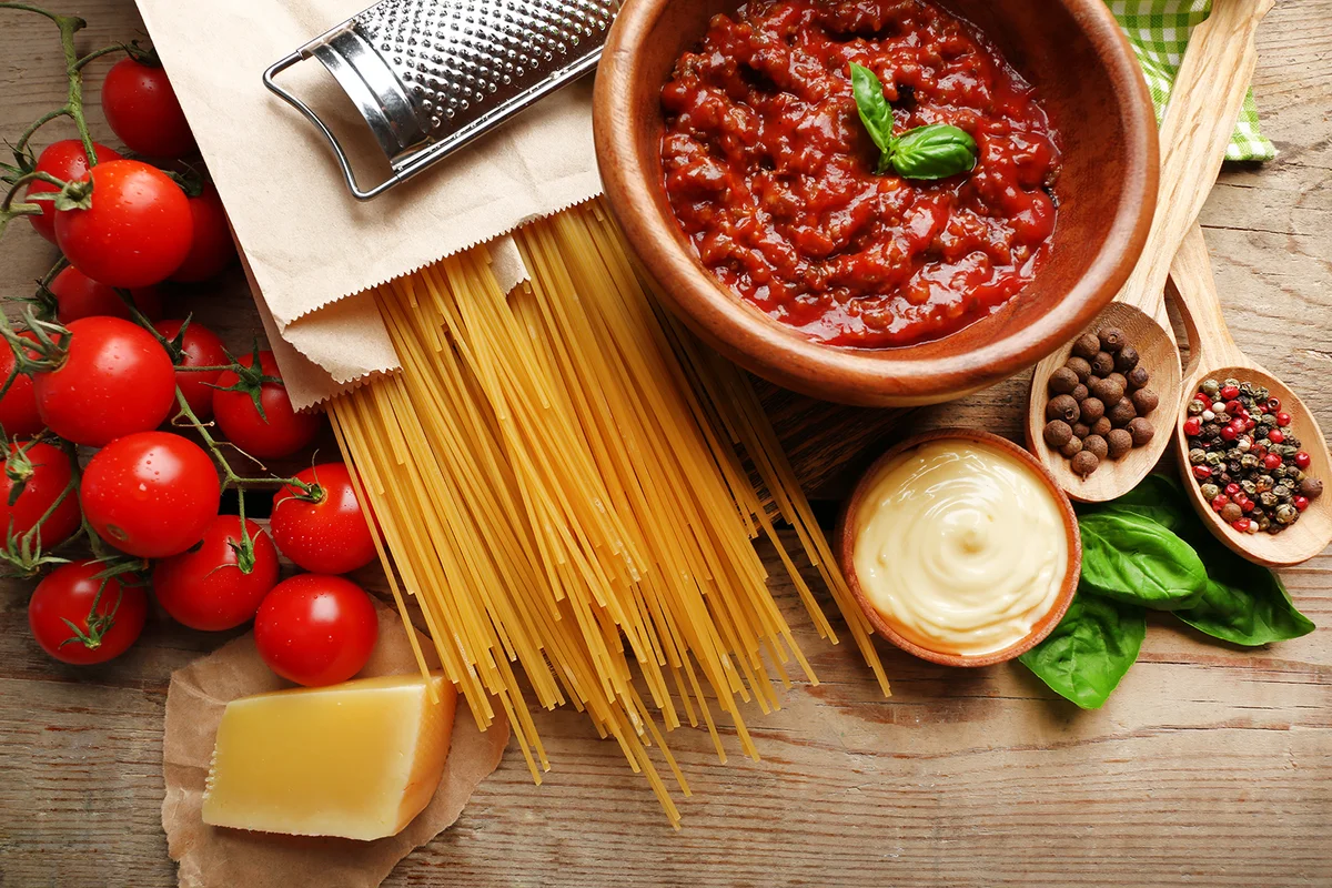 Pasta spaghetti with tomatoes, sauce bolognese, cheese and basil