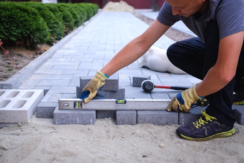 Man installing pavers