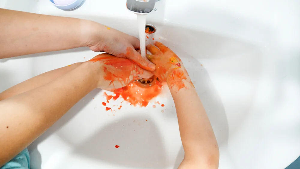 washing paint off hands