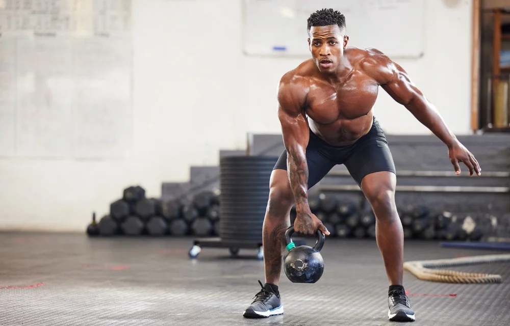 man doing a kettlebell workout