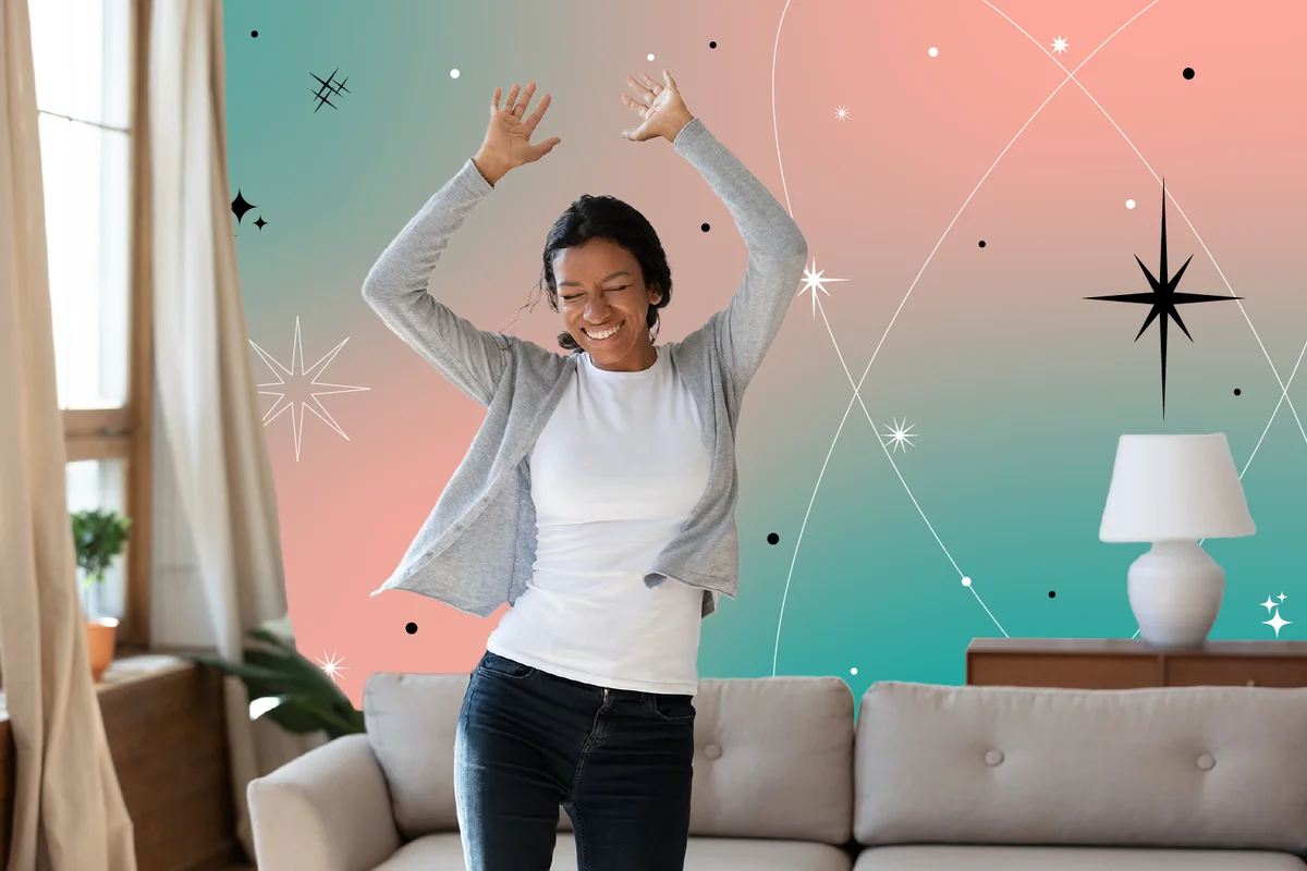Happy laughing young woman dancing to energetic music