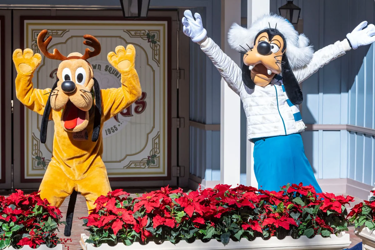 Pluto and Goofy pose for a photo