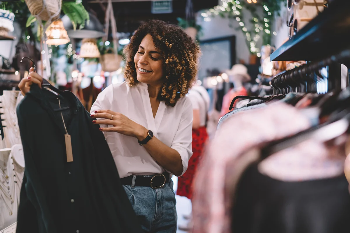 Woman at fashion store shopping for clothes