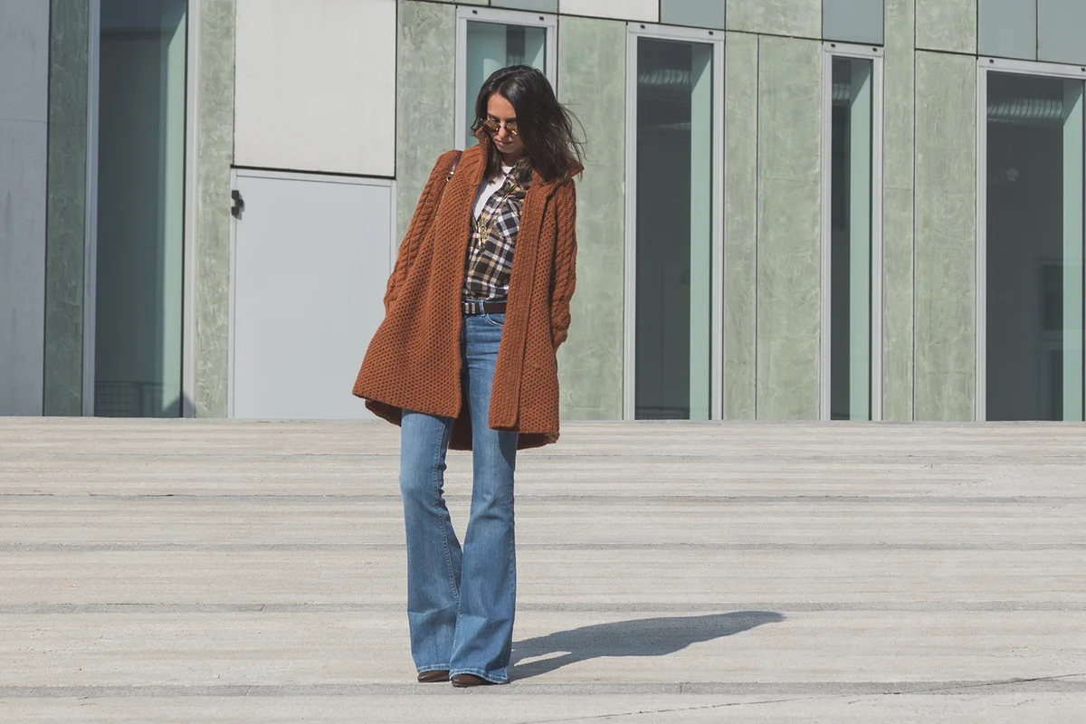 Beautiful girl with long hair posing in an urban context