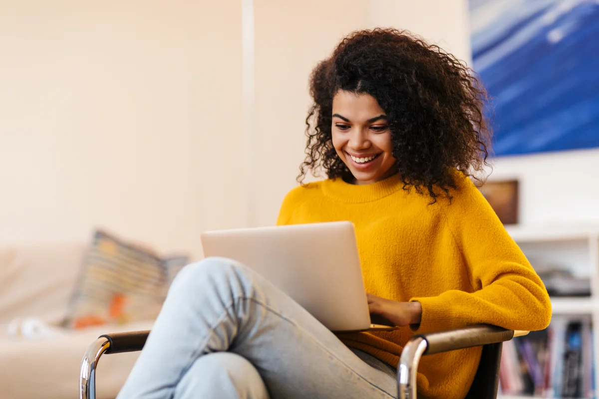 woman smiling with laptop