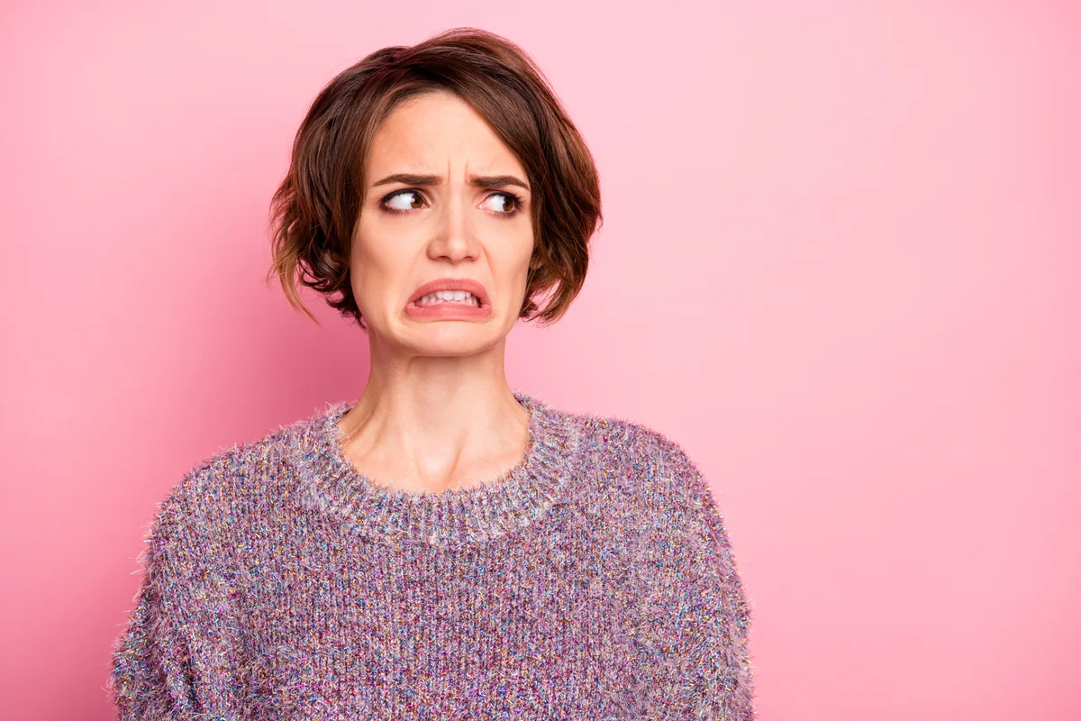 woman looking grossed out