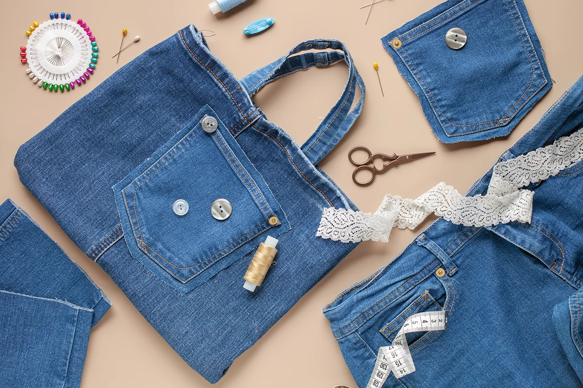 Old jeans and denim bag with sewing accessories