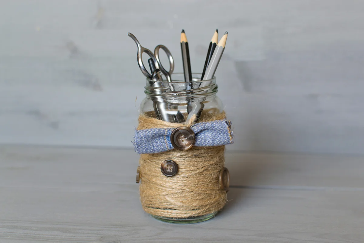 A jar with a butterfly braided by a tourniquet