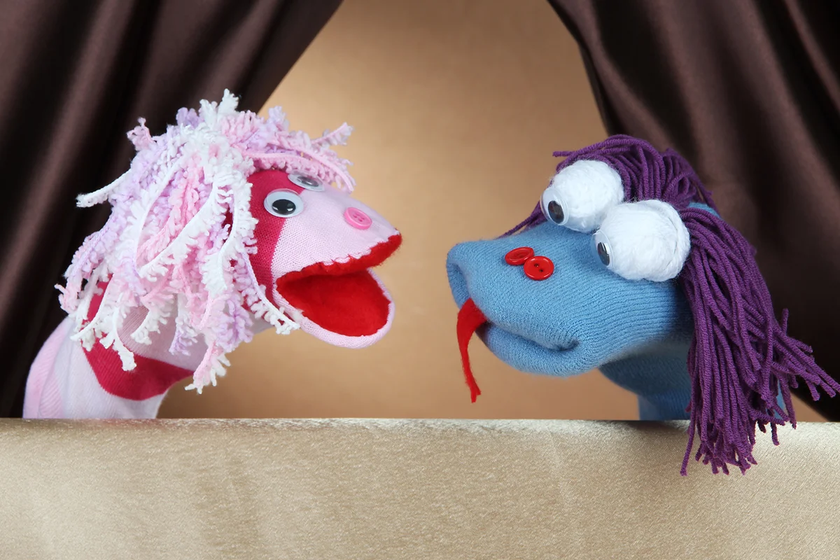 Puppet show on brown background