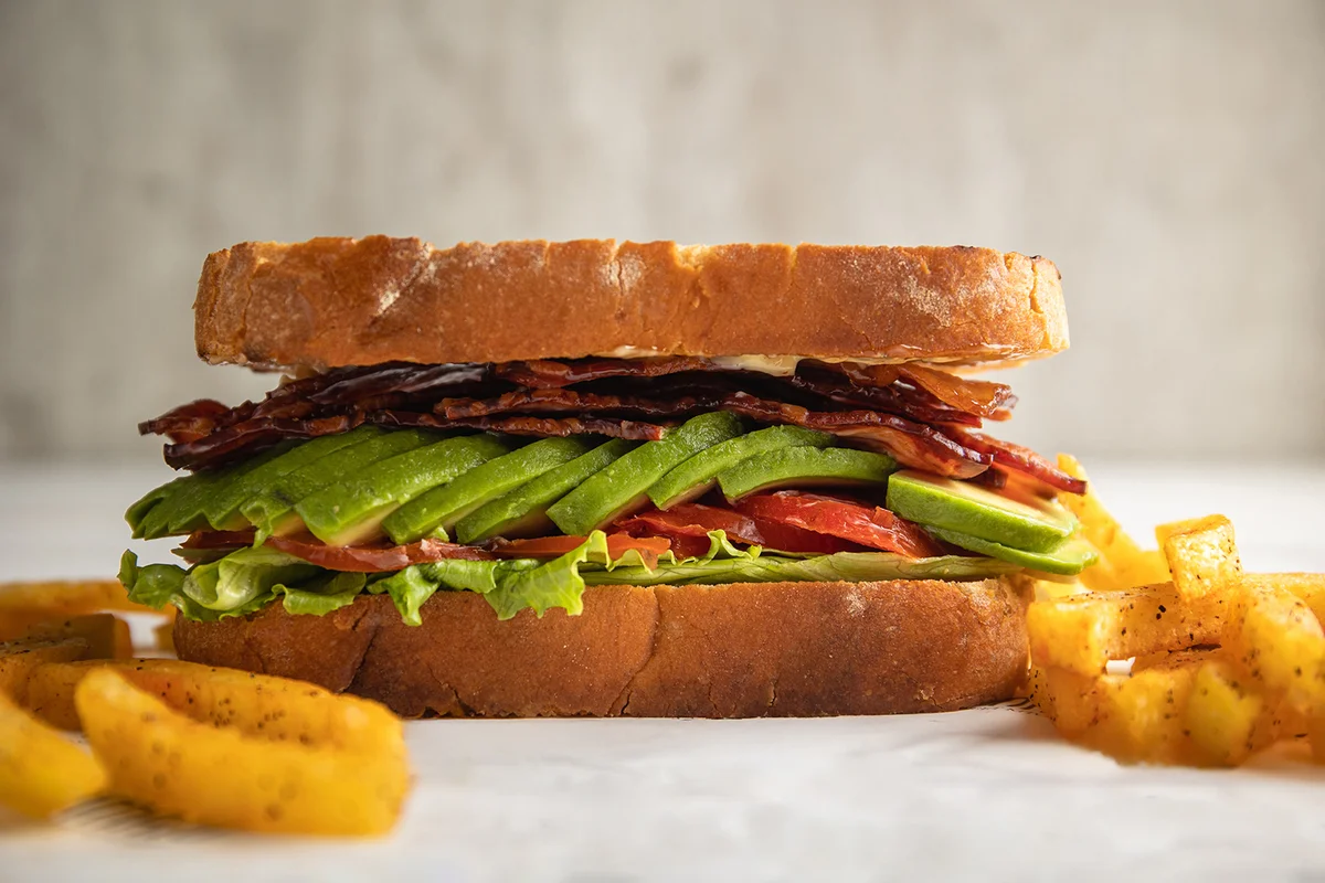 BLTA sandwich on toasted white bread