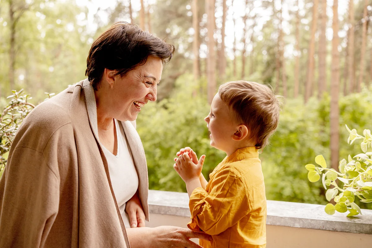 Happy grandmother and grandson enjoy time together.
