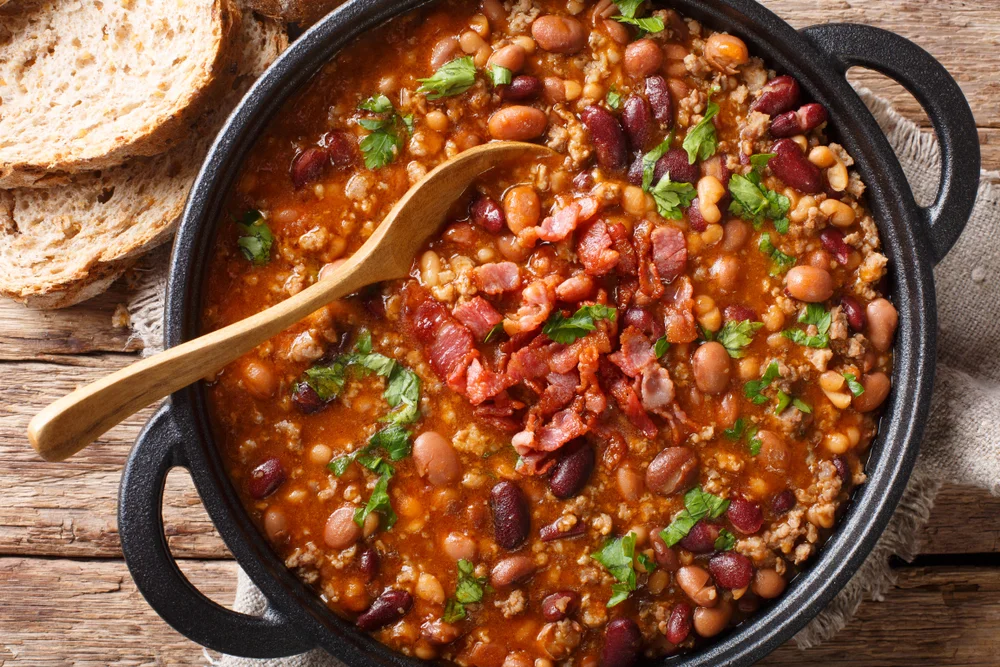 cast-iron pot full of BBQ baked beans