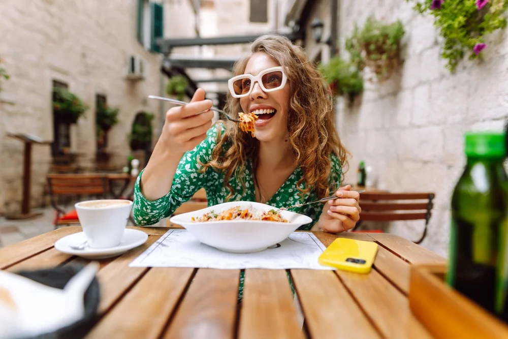 woman taking a bite of food