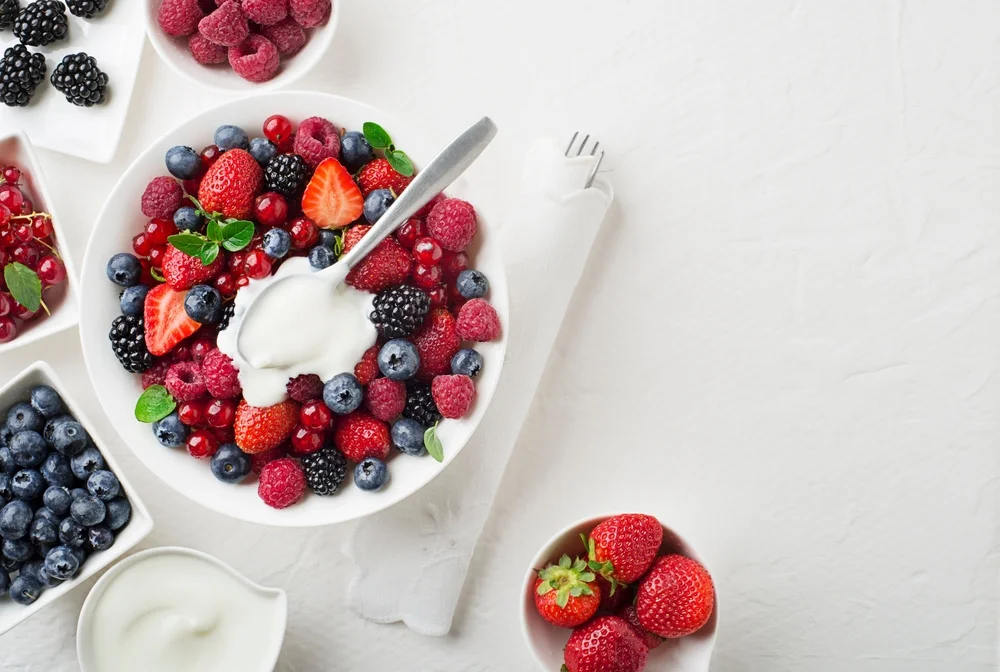 berries and cream in a bowl
