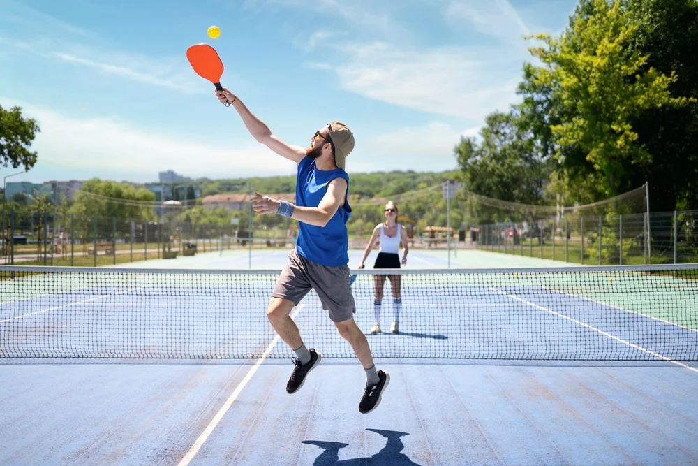 couple playing pickleball
