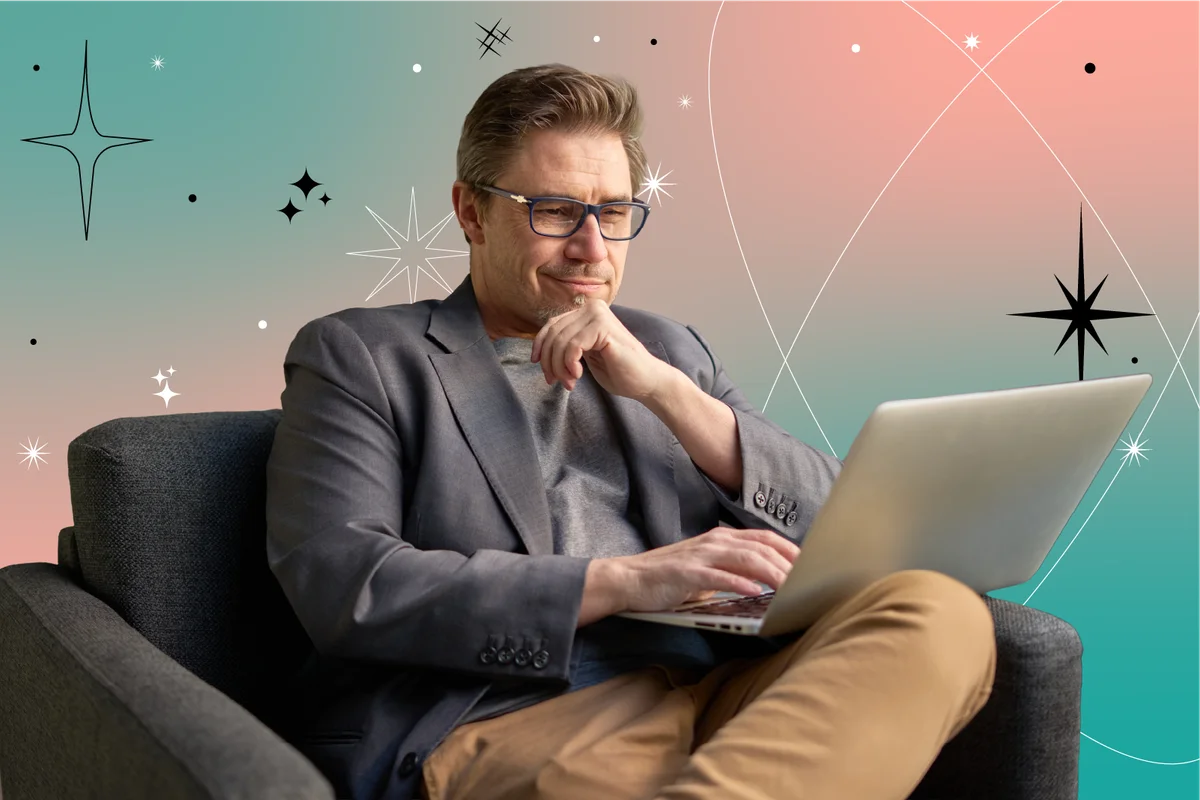 Businessman using laptop computer in office lobby