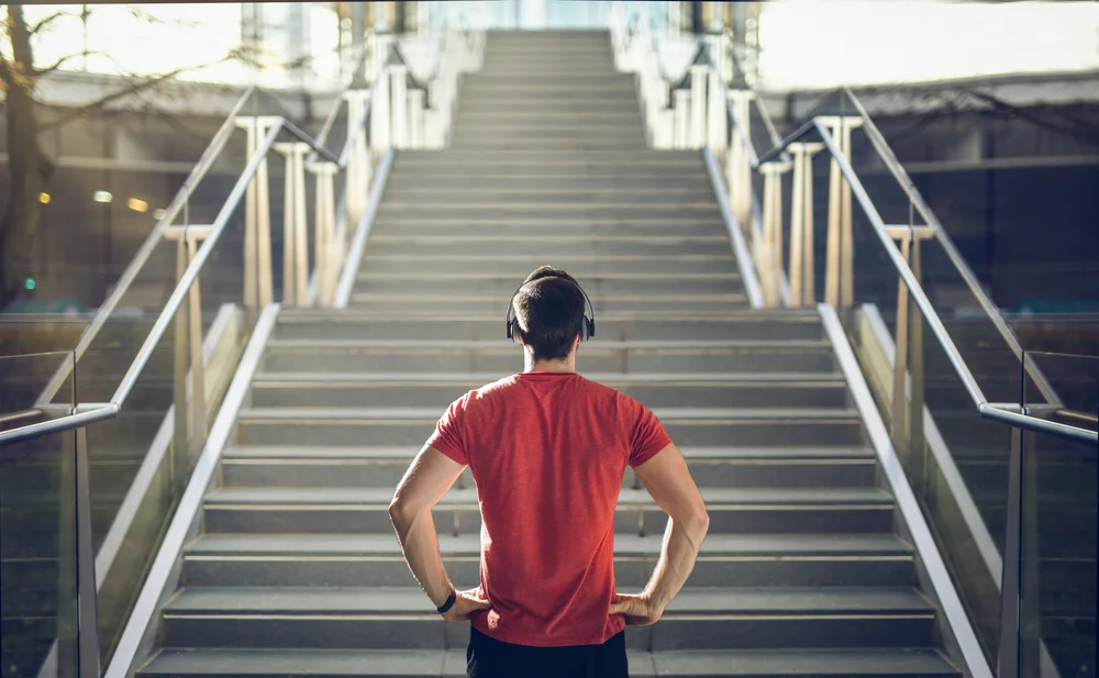 runner looking up a staircase
