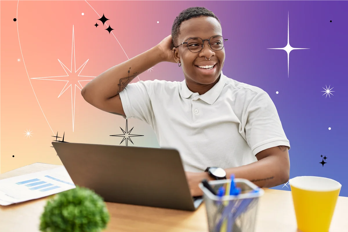 man working at the office using computer laptop smiling confident